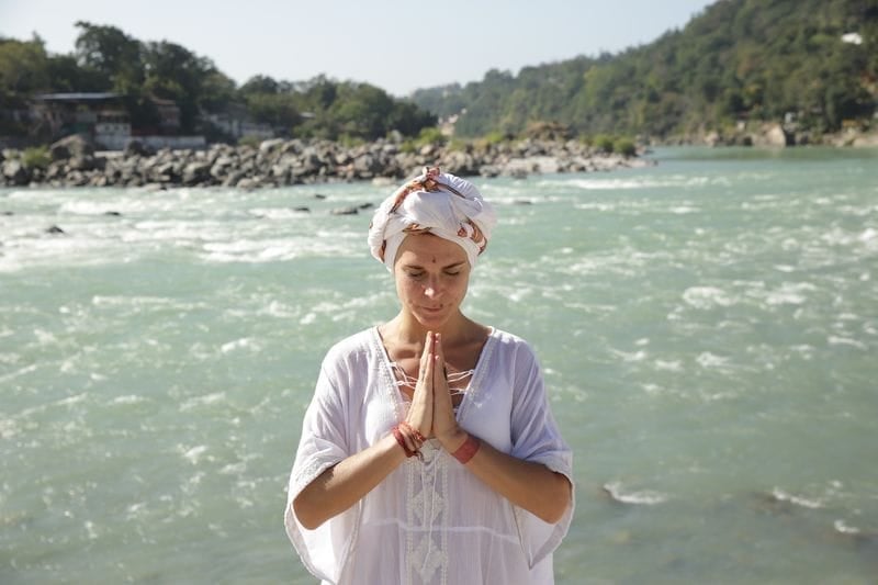 A woman in white praying