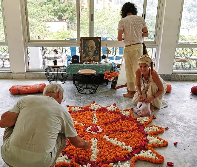 People preparing a room for yoga class