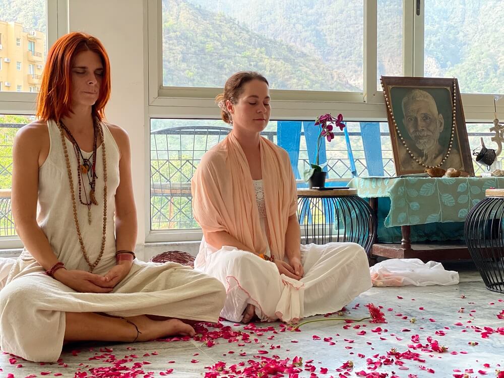 Two women meditating